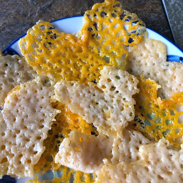 plate of heart shaped cheese crisps