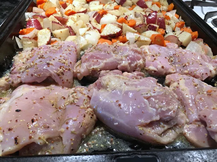 add lemon garlic chicken to sheet pan