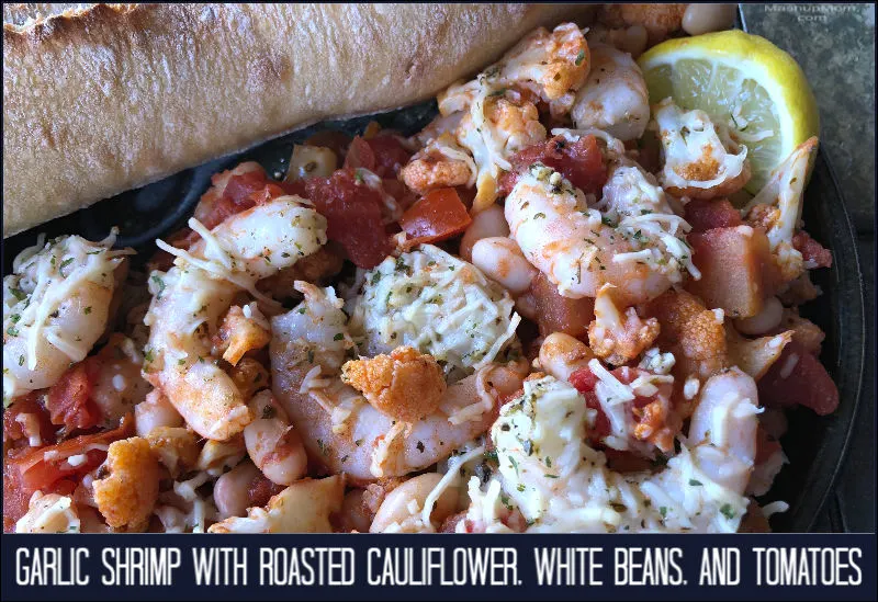 A comfort food skillet of garlic shrimp with roasted cauliflower, white beans, & tomatoes.