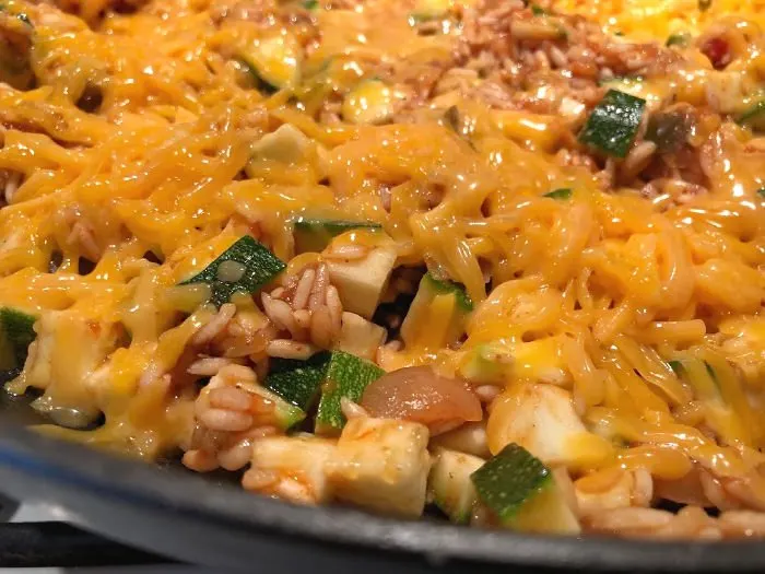 top spanish rice with cheese
