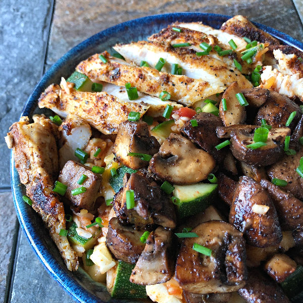 zucchini burrito bowl with chicken and mushrooms and rice