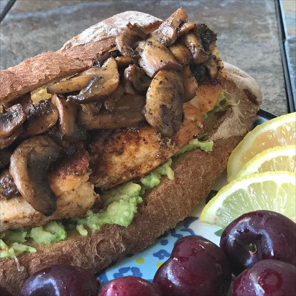 chicken sandwich with mushrooms and avocado