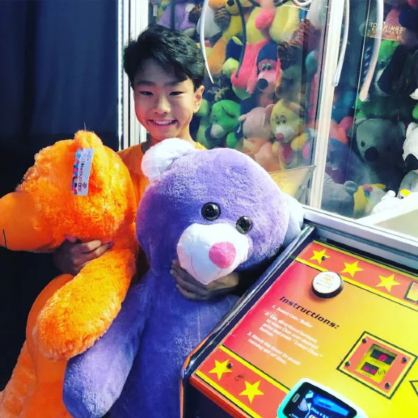 two giant bears from the claw machine at dave & busters