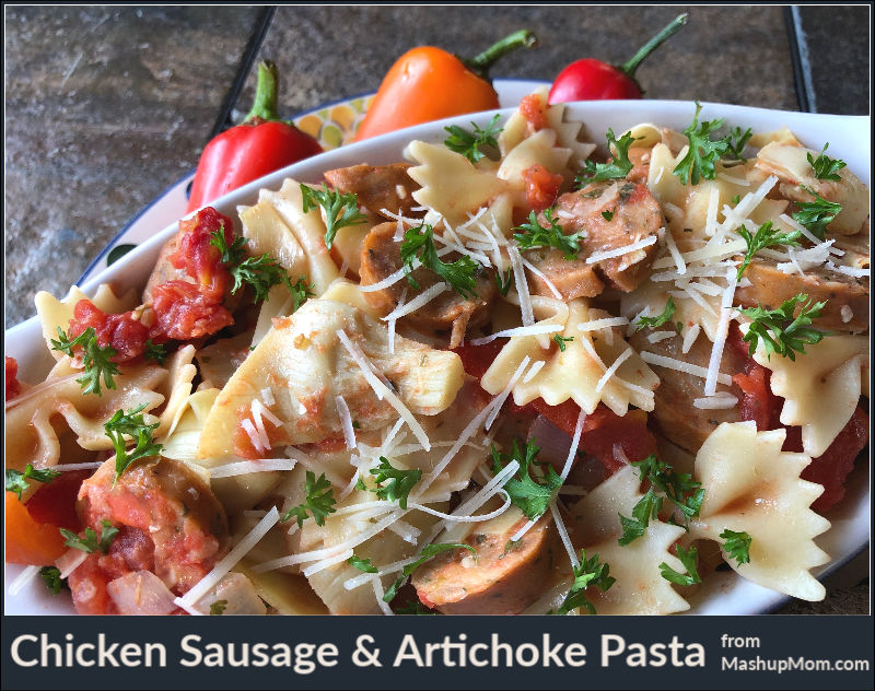 chicken sausage and artichoke pasta topped with Parmesan cheese