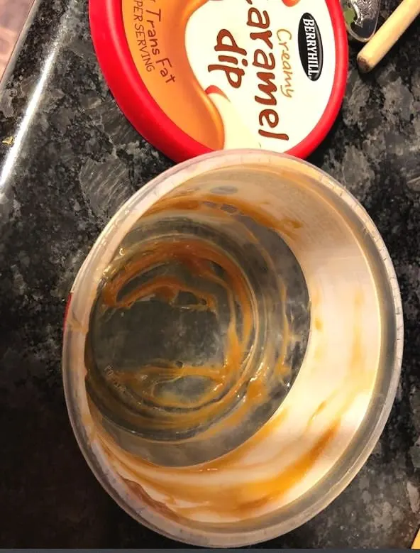 empty container of caramel dip