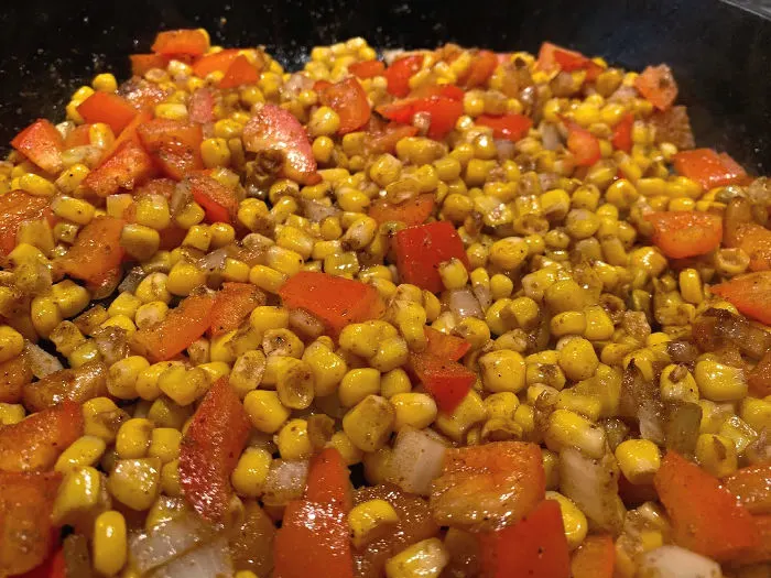 saute corn and pepper in a cast iron skillet