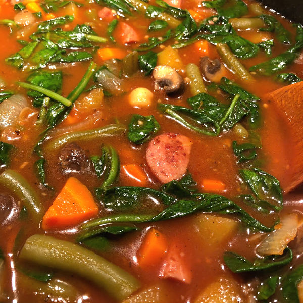 wilt in spinach to harvest veggie stew