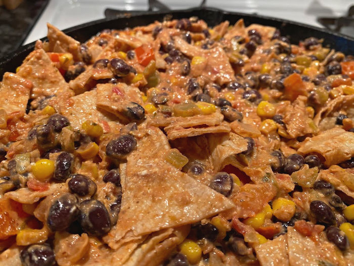 mix torn corn tortillas into the vegetarian enchiladas skillet