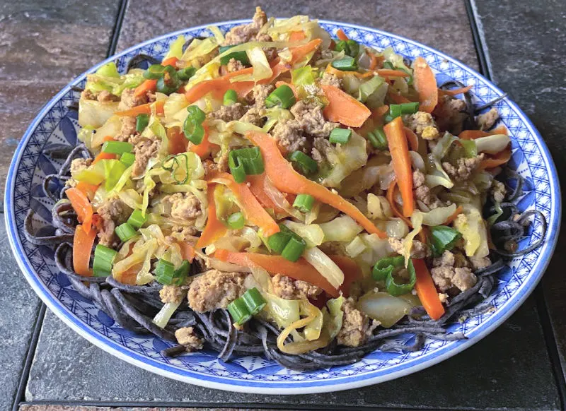 plate of egg roll in a bowl with soybean noodles