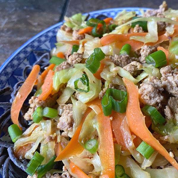 egg roll in a noodle bowl