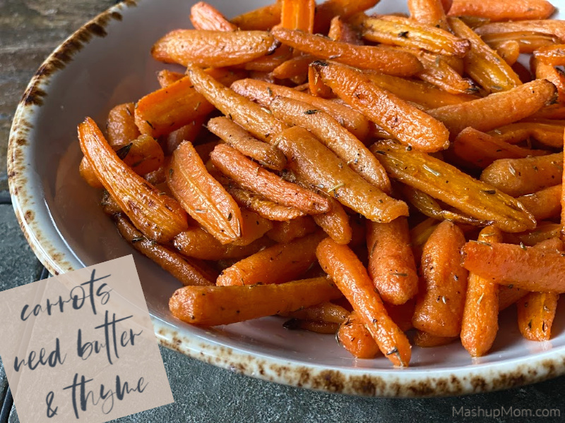 A dish of roasted carrots seasoned with butter and thyme