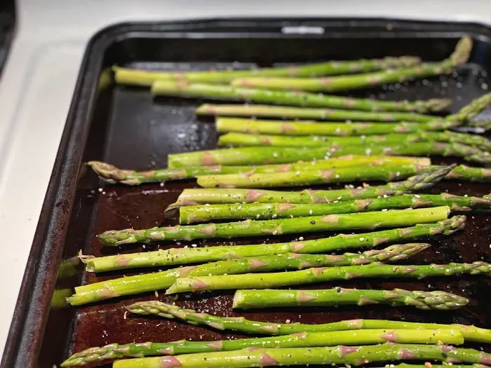 seasoned asparagus on the sheet pan