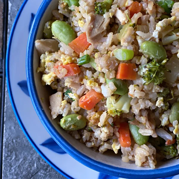 Bowl of chicken fried rice with veggies