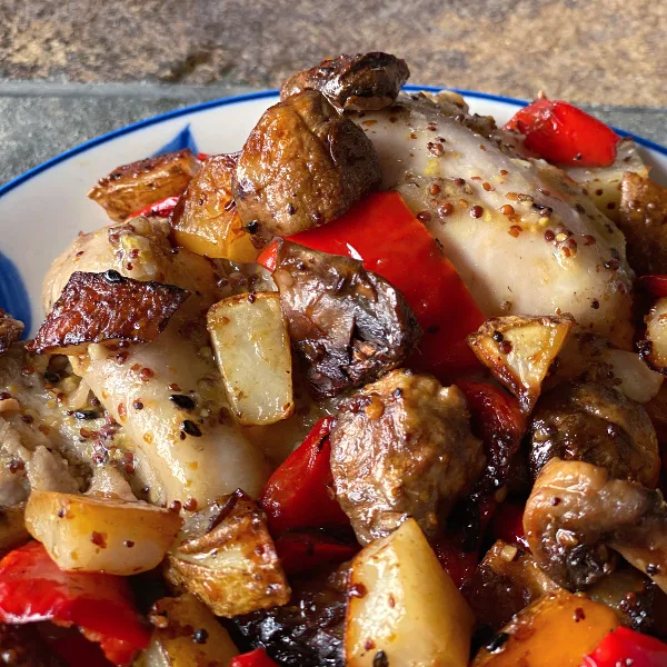 plate of everything roasted sheet pan chicken and vegetables 