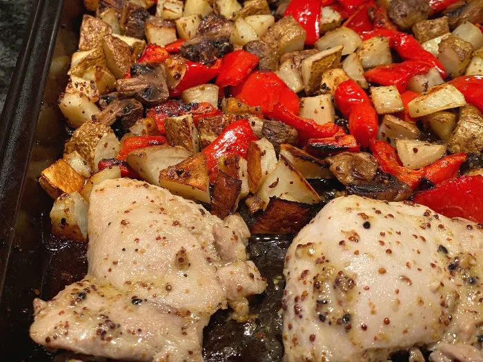 roasted chicken and vegetables on the pan