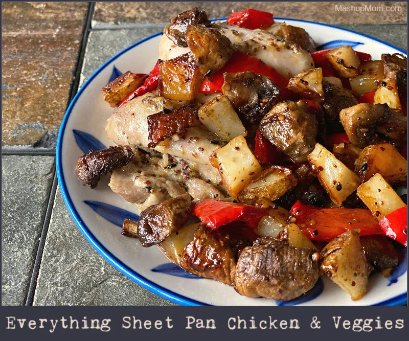 everything sheet pan chicken, on a blue and white plate