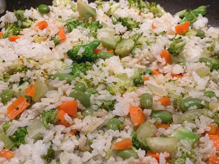 spread out the rice in the pan for fried rice