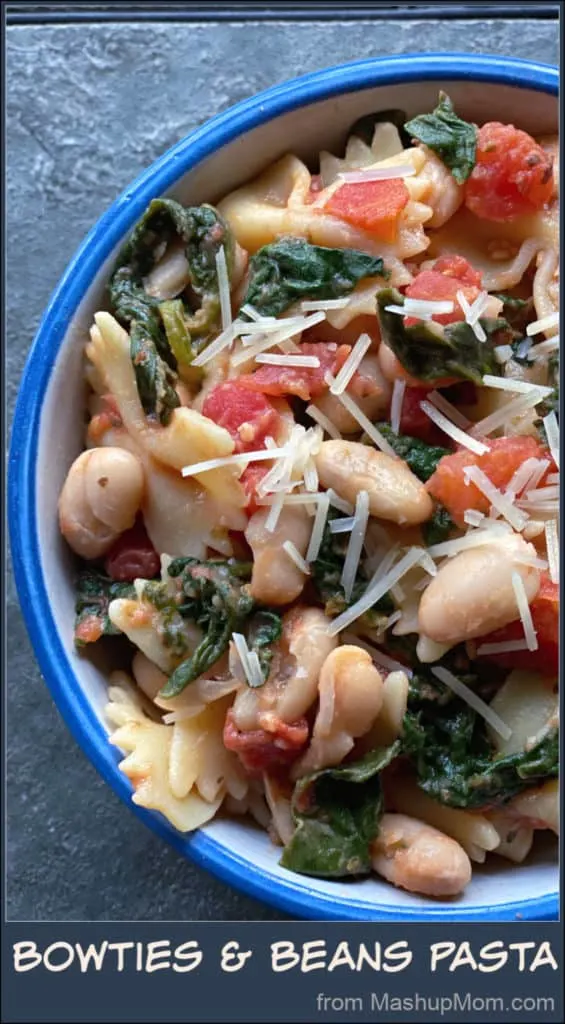 This 25 minute vegetarian Bowties & Beans Pasta recipe with white beans, spinach, and tomatoes comes together quickly on a busy weeknight, using mostly pantry staples! Flavorful & filling for your Meatless Monday. 
