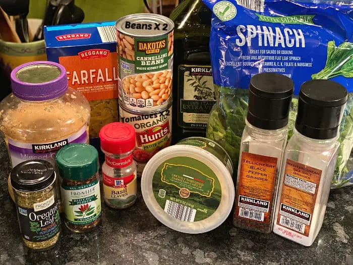 Ingredients for bowties & beans pasta with tomatoes and spinach