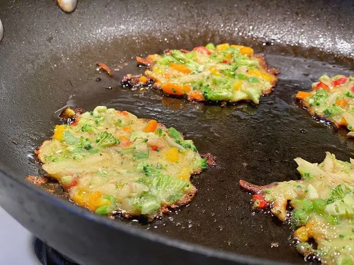 Fry Korean vegetable pancakes in a skillet