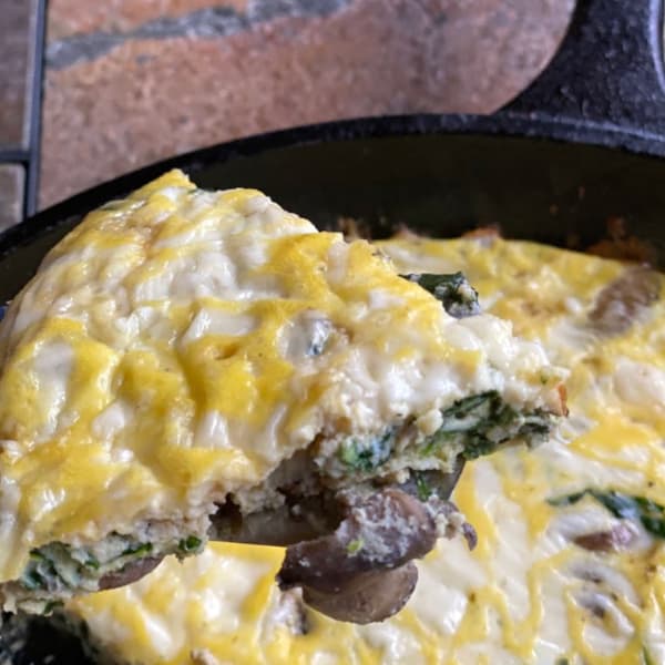 serving slices of spinach mushroom frittata