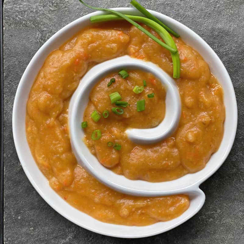 Creamy salsa potato soup in a fun spiral bowl