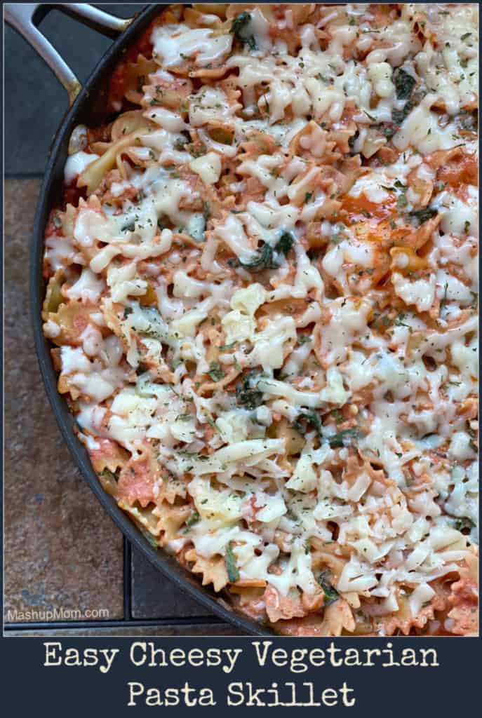 Meatless Monday is now the best night of the week! Easy Cheesy Vegetarian Pasta Skillet has it all -- artichokes, mushrooms, sweet bell pepper, onion, and spinach, all nestled together in a beautifully cheesy pan full of pasta. Tastes like lasagna, but with a fraction of the effort. 