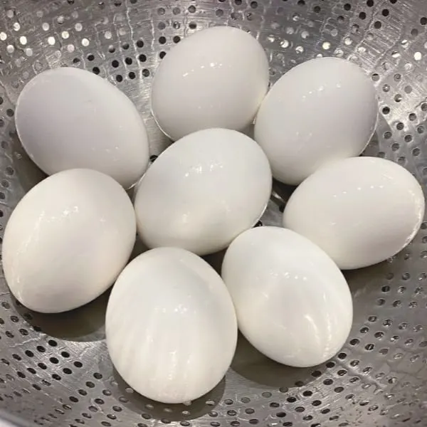 cool eggs under running water