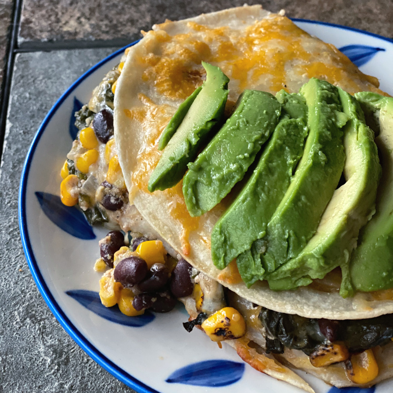 vegetarian elote tortilla casserole with avocado