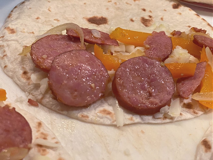 Assemble the kielbasa quesadillas