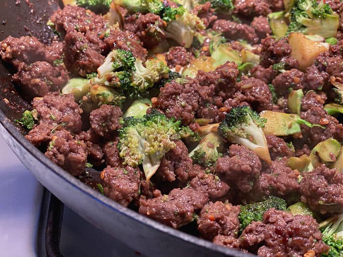 beef and broccoli stir fry in skillet