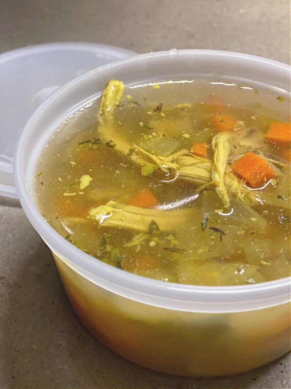 chicken soup in a freezer container