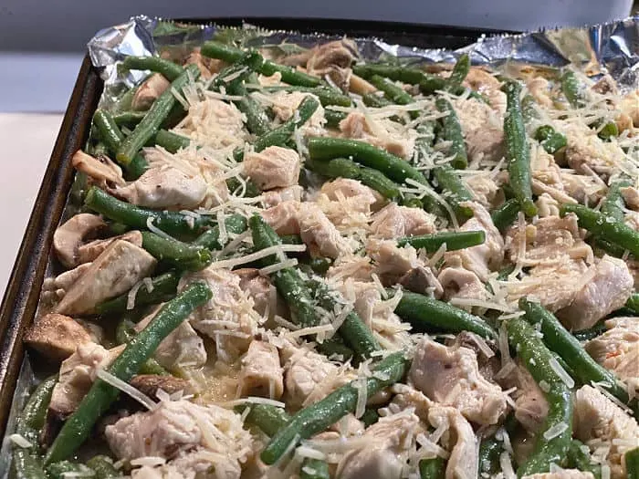 top chicken and vegetables with Parmesan cheese