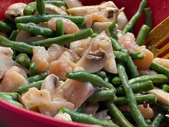 toss chicken and veggies in dressing