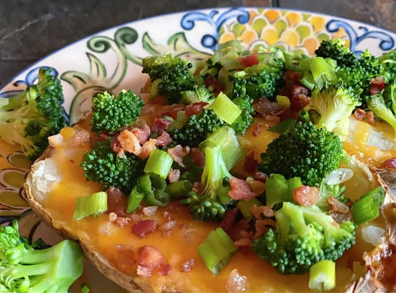 Baked potato with broccoli, cheese, bacon bits, and more