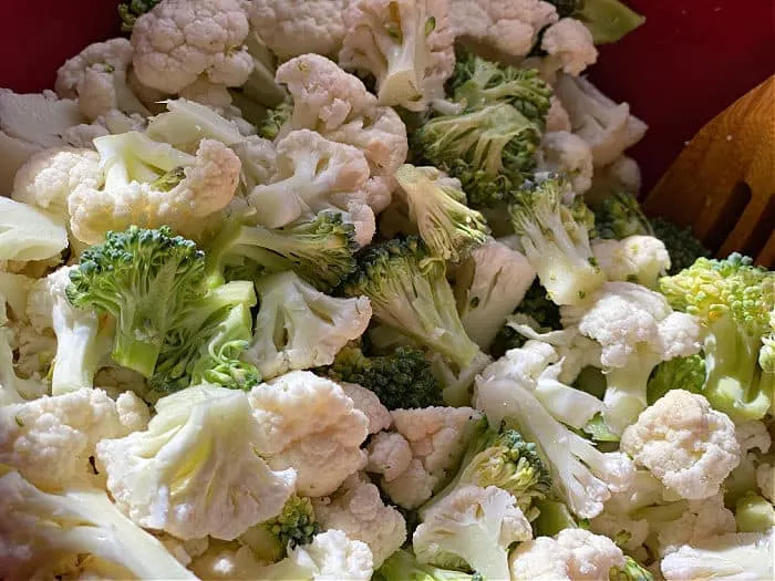 Chop broccoli and cauliflower for casserole