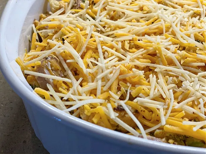 top the casserole with shredded cheese