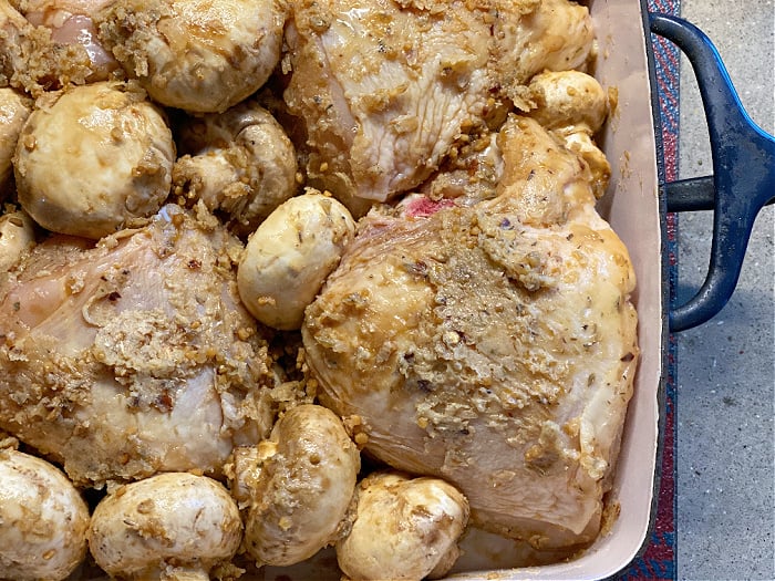 mushrooms and chicken in a baking dish