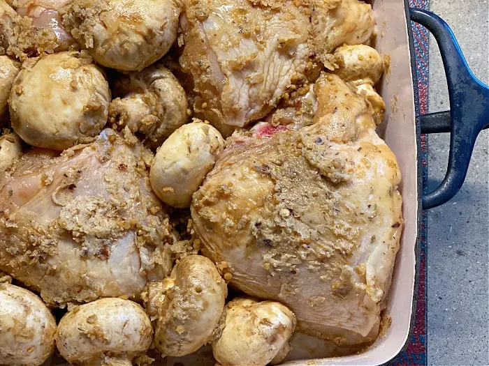 mushrooms and chicken in a baking dish