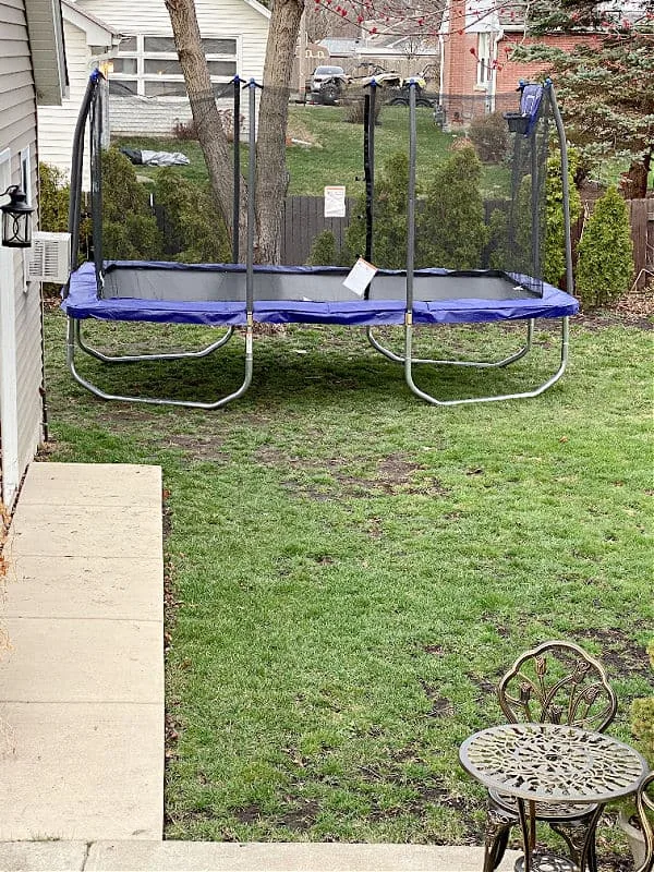 trampoline with a basketball hoop