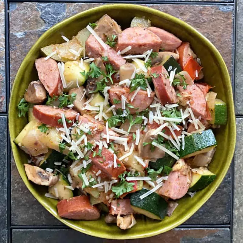 skillet sausage, zucchini, and veggies in a bowl