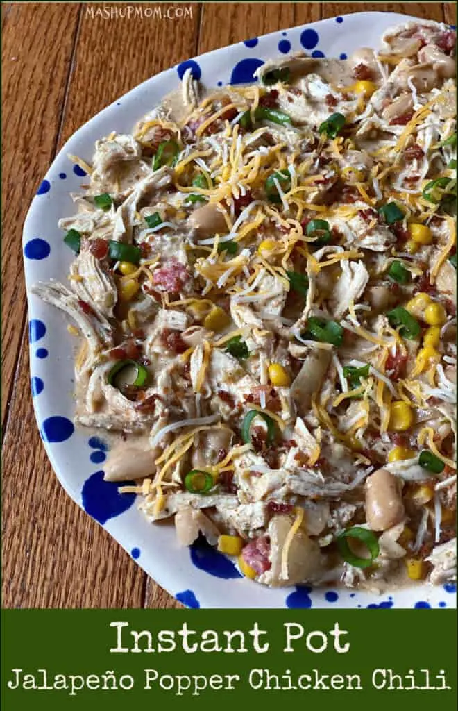 Instant Pot Jalapeno Popper Chicken Chili topped with cheese and green onions