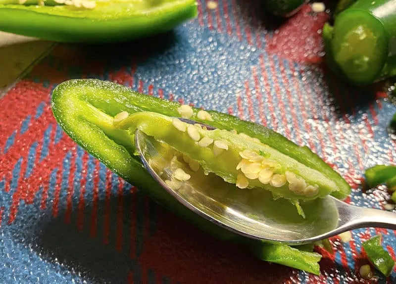 scoop out jalapeno seeds