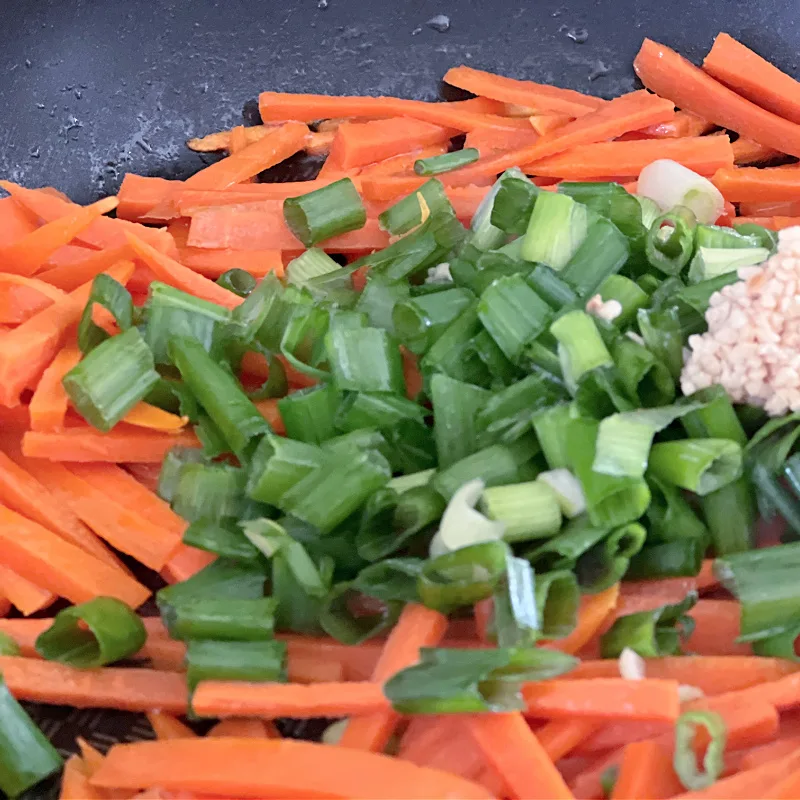 add green onion and garlic to pan