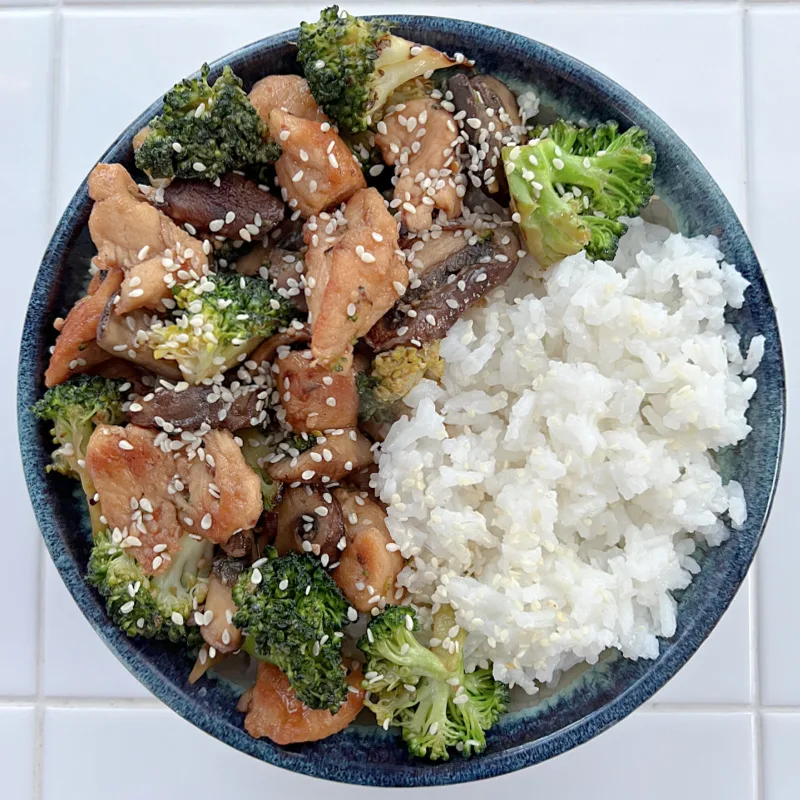 bowl of chicken stir fry and rice