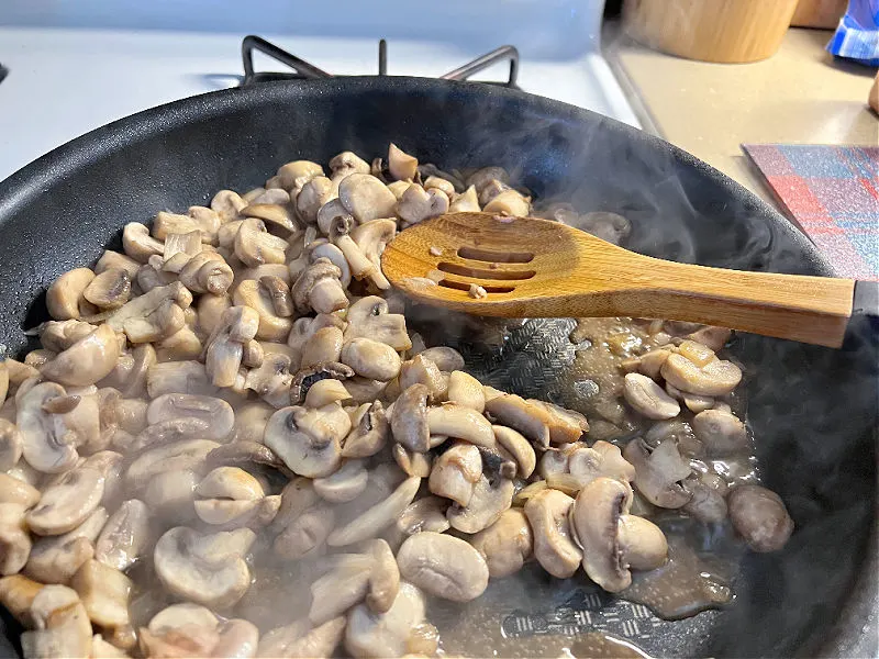 mushrooms browning in a skillet