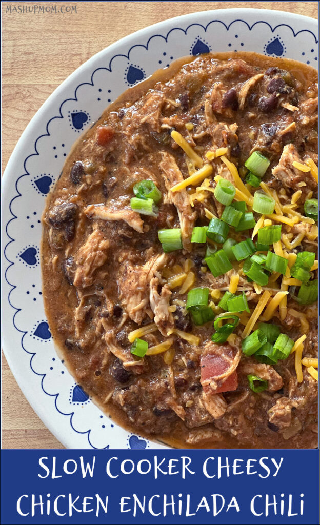 bowl of cheesy chicken chili with green onions