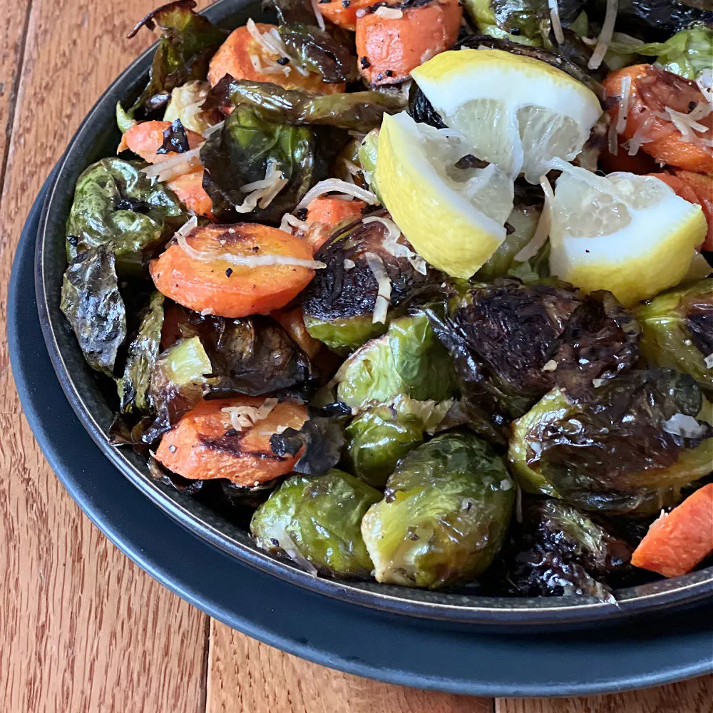 bowl of parmesan roasted brussels and carrots