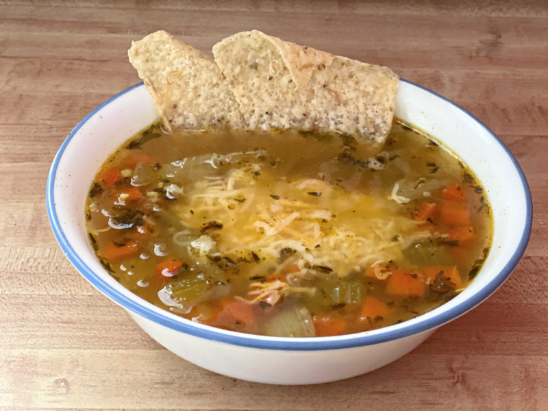 soup with cheese and tortilla chips