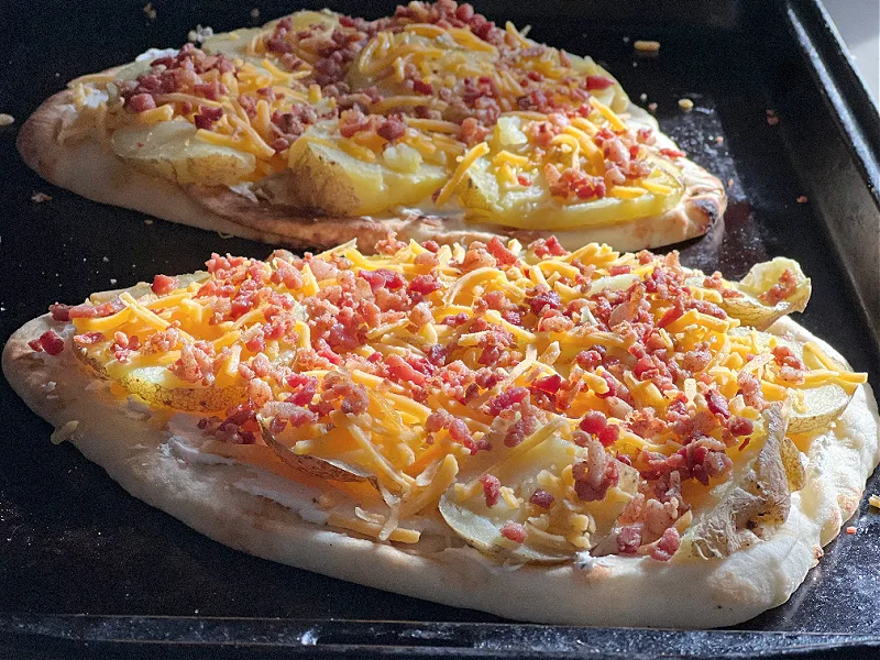 potato pizzas ready to go in the oven